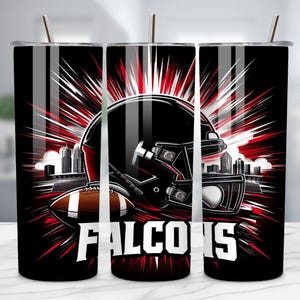 May include: Three black insulated tumblers with a football theme. Each tumbler features a black football helmet, a football, and the word "Falcons" in white. The design includes red and white accents with a cityscape background.
