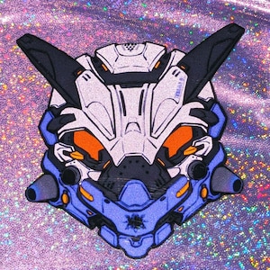 May include: A detailed robot face design in blue, white, black, and orange. The design features angular shapes and mechanical details, set against a shimmering, iridescent background.