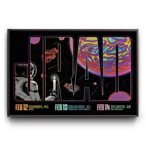 May include: Black framed poster with the word "JAM" in large, colorful, psychedelic lettering. The background features an astronaut, planets, and stars. Dates and locations of events are listed at the bottom.