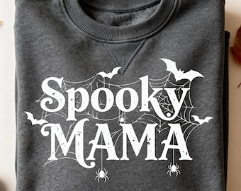 May include: Dark gray sweatshirt with the words "Spooky MAMA" in white, featuring a spiderweb design, bats, and spiders. A cozy, crew neck sweatshirt perfect for Halloween or spooky season.
