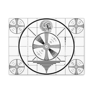 May include: A black and white canvas print featuring a vintage television test pattern. The design includes concentric circles, lines, and a Native American headdress illustration. The print also has numbers and calibration marks.