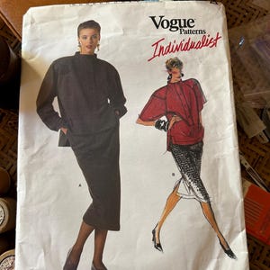 May include: Vogue Patterns Individualist sewing pattern for a jacket and skirt. The pattern is by Claude Montana and the pattern number is 1768.