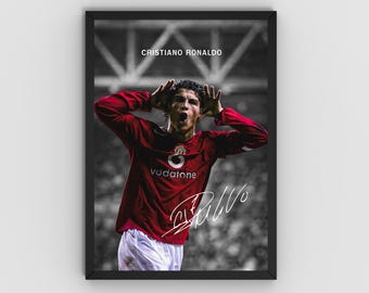 May include: Framed poster featuring Cristiano Ronaldo in a red jersey with the Vodafone logo and a white signature. The image shows Ronaldo with his hands near his head, with the text "CRISTIANO RONALDO" at the top.