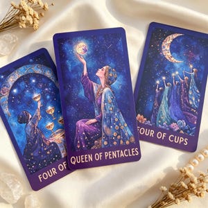 May include: Three rectangular tarot cards with dark blue starry backgrounds. The left card is labelled FOUR OF CUPS, the centre card is labelled QUEEN OF PENTACLES, and the right card is labelled FOUR OF CUPS, featuring illustrations of figures and celestial motifs.