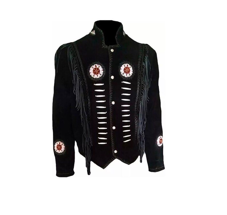 May include: A black jacket featuring long fringe detailing along the chest and sleeves. The front is adorned with two circular beaded medallions in red, white, and black, alongside vertical rows of white bone-style accents and silver buttons.