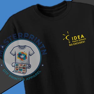 May include: Black t-shirt with a yellow lightbulb graphic and the text "IDEA Public Schools NO EXCUSES!" on the front. A circular logo with a t-shirt design is on the left side. The shirt is made of a soft material.