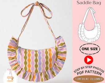 May include: A crescent-shaped saddle bag with a ruffled edge and a long shoulder strap, featuring a wavy vertical stripe pattern in olive green, orange, and lavender. Text includes Easy Ruffled Saddle Bag, ONE SIZE, and STEP BY STEP PHOTOS PDF PATTERN.