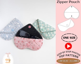 Peut inclure: Trois pochettes matelassées en forme de cœur avec fermetures à pression. L'une est bleu clair à motifs floraux blancs, l'une vert menthe à marguerites blanches, et l'une rose à fraises avec un intérieur à pois noirs contenant des lunettes.