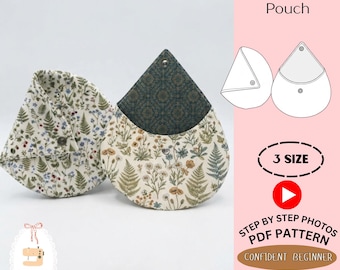 Peut inclure: Deux porte-monnaie en forme de goutte avec des motifs floraux et de fougères dans des tons crème, vert et bleu. Chaque pochette possède une fermeture à pression métallique. Le texte indique DIY Sleek Coin Pouch, 3 SIZE, STEP BY STEP PHOTOS PDF PATTERN et CONFIDENT BEGINNER.
