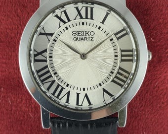 Seiko Slim Men's Tank Style Quartz Vintage Wrist Watch | Round Shape | White Dial | Black Leather Band | DDP for US Customers