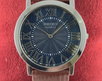 Tank Style Seiko Slim Blue Dial Leather Band Men Quartz Wristwatch : Roman Numerals, Round Shape