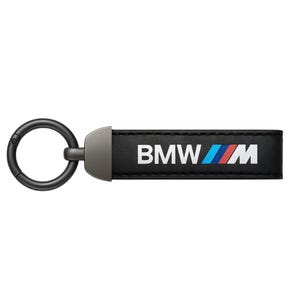 May include: Black leather keychain with the BMW logo in white, blue, and red. The keychain has a metal clasp and a rectangular leather tag. The BMW M logo is displayed on the tag.