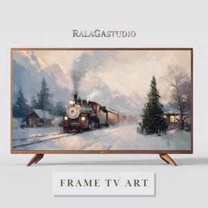 May include: A wooden-framed TV displaying a winter landscape painting with a steam train. The artwork features a snowy scene with a train, trees, and buildings. The text "RALAGASTUDIO" and "FRAME TV ART" are visible.