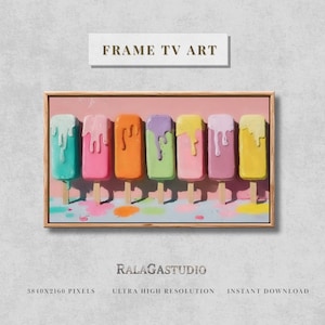 May include: A framed art print featuring seven colorful popsicles on wooden sticks. Each popsicle has a different color and flavor, with drippings of white frosting. The artwork is labeled "FRAME TV ART".