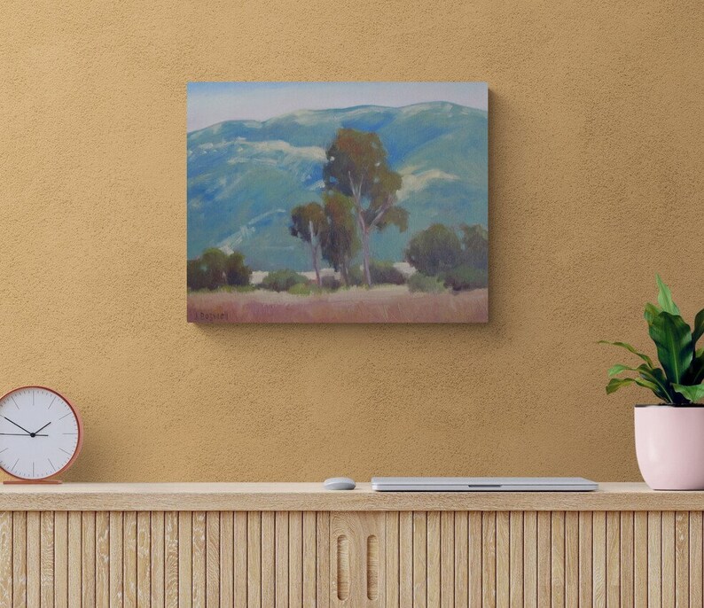 May include: A painting of a landscape with a group of trees in the foreground and rolling hills in the background. The sky is a light blue and the hills are a muted green and blue.