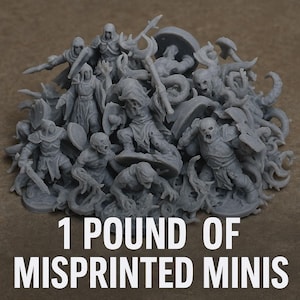 May include: A pile of gray misprinted miniature figures, including warriors, monsters, and creatures. The text "1 POUND OF MISPRINTED MINIS" is displayed in white at the bottom of the image.