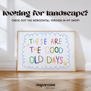May include: A framed print with the text "THESE ARE THE GOOD OLD DAYS" in colorful, handwritten-style letters. The print has a light blue wavy border and a gold star. The words "looking for landscape?" are at the top.