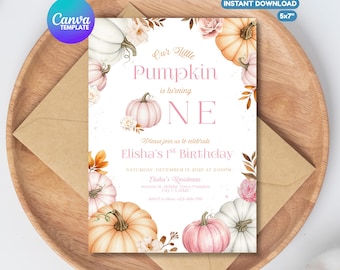 May include: A Canva template invitation card with a pumpkin theme. The card features watercolor illustrations of pumpkins, flowers, and leaves. Text includes "Our Little Pumpkin is turning ONE" and details for Elisha's 1st Birthday. The card is 12.7 x 17.8 cm.