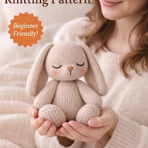May include: A beige knitted bunny toy with closed eyes and a small brown nose is held in someone's hands. The text "Sleepy Bunny Knitting Pattern" and "Beginner Friendly!" are displayed above the bunny.