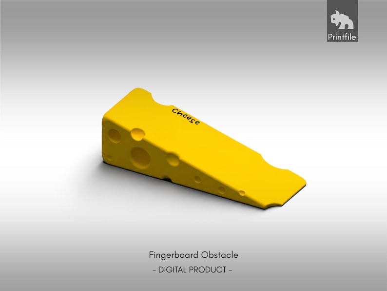 May include: A bright yellow wedge-shaped fingerboard obstacle designed to resemble a block of Swiss cheese, featuring several circular holes of varying sizes on its side and the word Cheese printed in black text on the top surface.