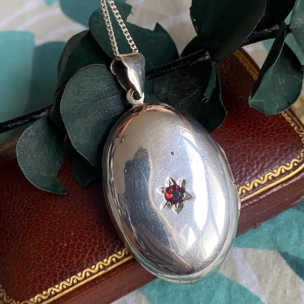 Vintage silver locket star-set with garnet gemstone