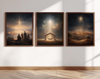 May include: Three framed wall art prints depicting a nativity scene. The left print shows figures overlooking a glowing city, the center print features a manger under a bright star, and the right print displays a landscape under a starry night sky.