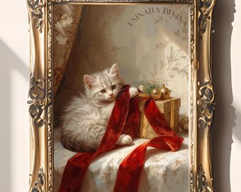 May include: A framed painting featuring a fluffy white kitten playing with a red ribbon. The kitten is near a small gift box and gold ornaments. The frame is ornate gold with the text "ESINARA DIVINA".