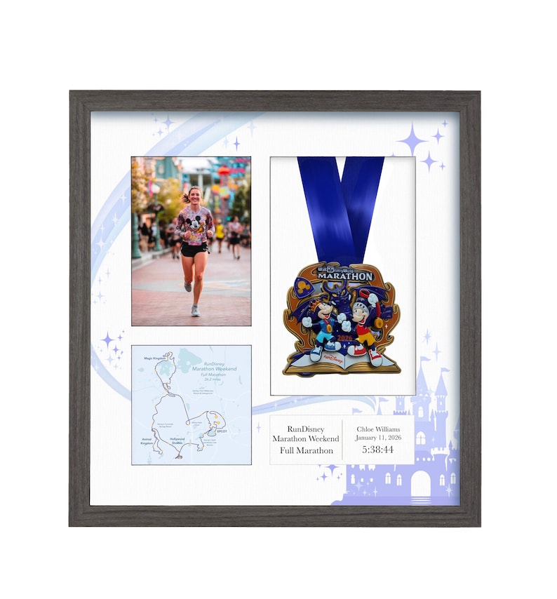 May include: Framed RunDisney Marathon Weekend memorabilia. The frame contains a photo of a runner, a map, and a medal with a blue ribbon. The medal features cartoon characters. The frame is gray.