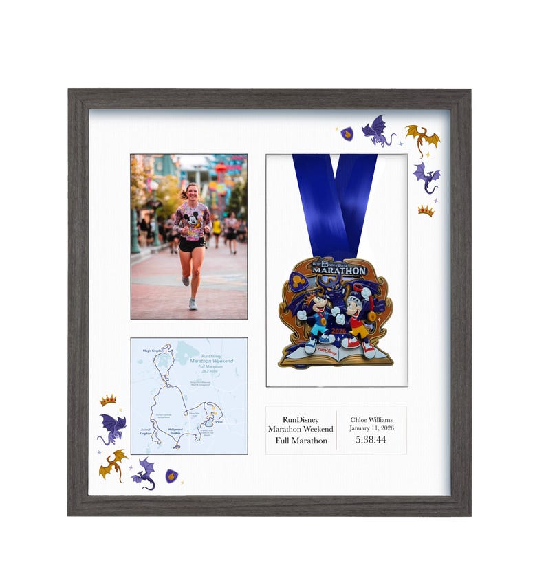 May include: A framed display featuring a photo of a runner, a marathon medal, and a map. The medal has a blue ribbon and a colorful design. The frame is gray with decorative dragon and crown accents.