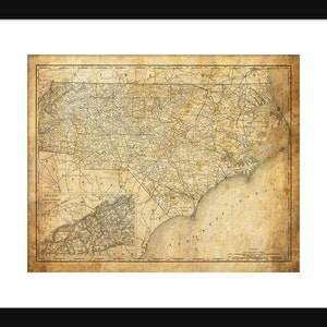 May include: An antique map of North Carolina with a vintage, aged paper texture. The map shows the state's counties, cities, and major roads. A smaller inset map shows the area around Raleigh, North Carolina.