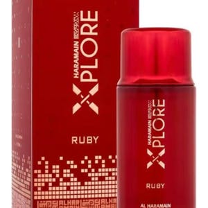 May include: A ruby red perfume bottle and box. The box and bottle feature the text "XPLORE" and "RUBY" in white. The brand name "AL HARAMAIN" is also visible on the bottle and box.