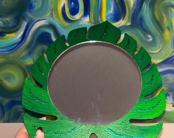 Espejo de hoja de Monstera que brilla en la oscuridad