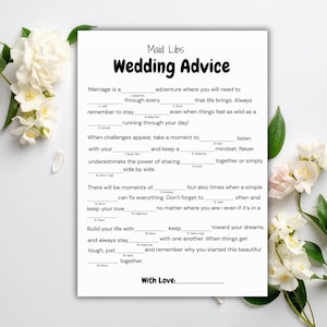Op de afbeelding: Een wit vel papier met een in zwart gedrukt Maid Libs Wedding Advice spel, voorzien van invullijnen voor woorden zoals bijvoeglijk naamwoord, werkwoord, zelfstandig naamwoord en dier. De tekst bevat instructies en een regel voor een handtekening.