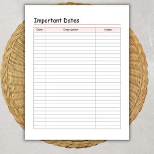 May include: A white sheet of paper with the words "Important Dates" at the top. The paper has a pink header and a grid of lines for writing dates, descriptions, and notes. The paper is on a woven, circular, brown surface.