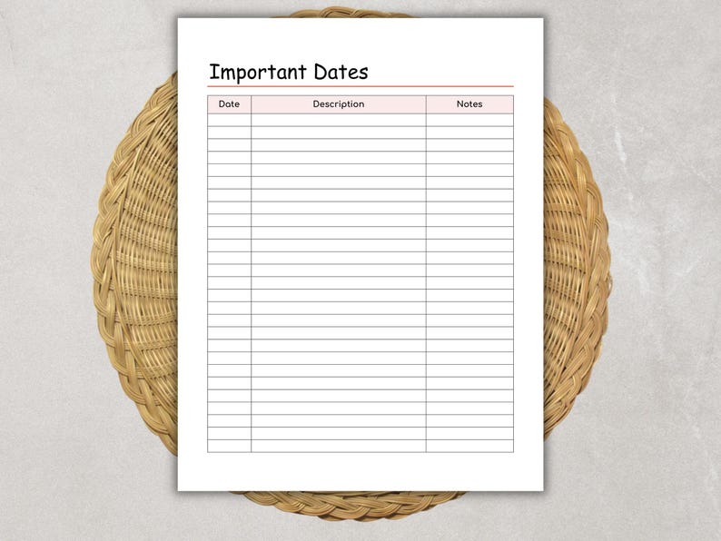 May include: A white sheet of paper with the words "Important Dates" at the top. The paper has a pink header and a grid of lines for writing dates, descriptions, and notes. The paper is on a woven, circular, brown surface.