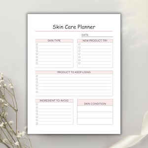 May include: A white Skin Care Planner with pink accents. The planner includes sections for skin type, new product trials, products to keep using, ingredients to avoid, and skin condition. The title "Skin Care Planner" is at the top.