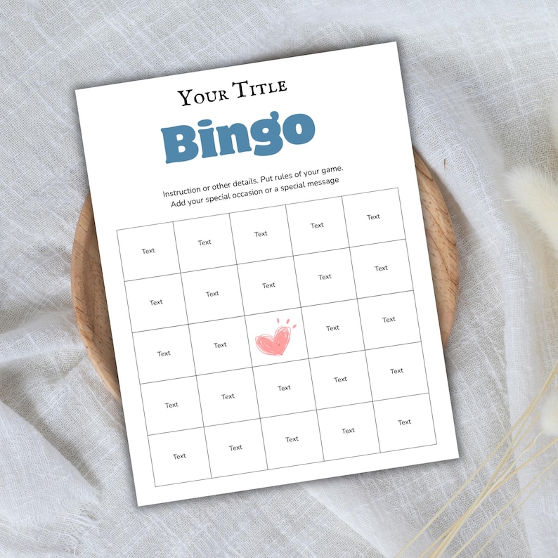 May include: A white Bingo game card with the title "Your Title" and the word "Bingo" in blue. The card has a grid of boxes labeled "Text" and a pink heart illustration. Instructions are included.