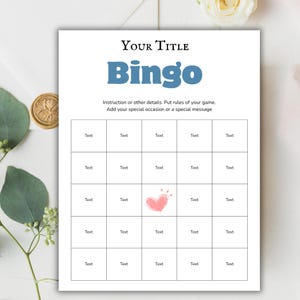Puede incluir: Una tarjeta de juego de Bingo blanca con texto azul que dice "Bingo" y "Your Title". La tarjeta tiene una cuadrícula de casillas con la palabra "Text" en cada una. Un corazón rosa está dibujado en una casilla. Instrucciones arriba.