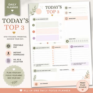 Può includere: Una pagina di pianificazione giornaliera con sezioni per le tre priorità principali del giorno, uno spazio per le idee, blocchi temporali e attività. Il layout presenta colori pastello tenui, illustrazioni di foglie e suggerimenti testuali.