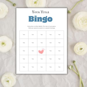 May include: A white Bingo game card with the title "Your Title" and the word "Bingo" in blue. The card has a grid of boxes with the word "Text" in each. A pink heart is in the center. White flowers are in the background.