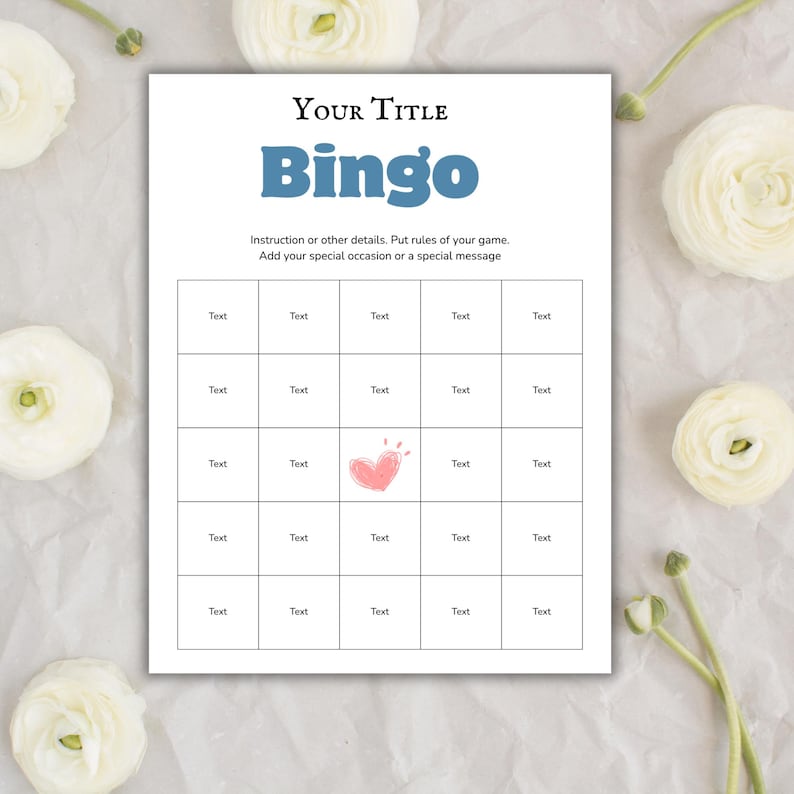 May include: A white Bingo game card with the title "Your Title" and the word "Bingo" in blue. The card has a grid of boxes with the word "Text" in each. A pink heart is in the center. White flowers are in the background.