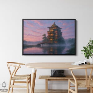 May include: A framed canvas print depicts a Japanese-style building on an island, connected by a red bridge. The artwork features a serene lake, lush trees, and a vibrant sunset with pink and purple hues. The canvas is framed in black.