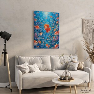 May include: A rectangular canvas wall art print featuring a vibrant underwater scene with a small child with orange hair in a red outfit swimming among numerous orange goldfish and colorful coral reefs under bright blue light rays.