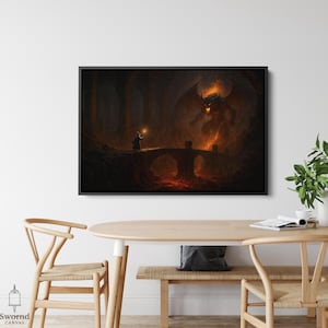 May include: A framed canvas print depicting a fantasy scene. A robed figure stands on a stone bridge, holding a glowing orb, facing a fiery demon. The artwork is set in a dark, cavernous environment with a river of lava.