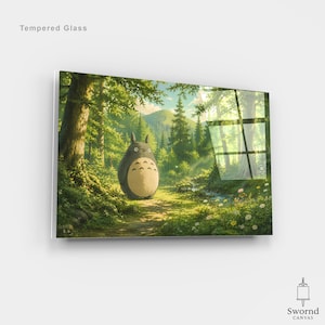 Puede incluir: Obra de arte de vidrio templado que representa una escena de bosque con una criatura grande, redonda y gris con vientre blanco. La ilustración está ambientada en un exuberante bosque verde con un sendero y un arroyo. El texto "Tempered Glass" está en la parte superior.