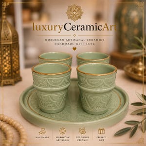 May include: A set of four green ceramic cups with gold rims and intricate patterns, presented on a matching tray. The image features the text "luxury CeramicArt" and "MOROCCAN ARTISANAL CERAMICS HANDMADE WITH LOVE". The set is labeled as handmade, Moroccan artisanal, lead-free ceramic, and a perfect gift.