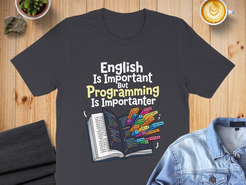 T-shirt with "English Is Important, Programming Is Importanter" text and code.