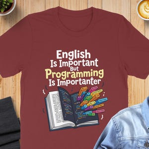 T-shirt with text "English Is Important But Programming Is Importanter" and code snippets.