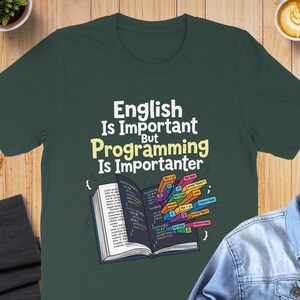 T-shirt with "English Is Important, Programming Is Importanter" and code snippets.