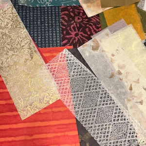 May include: Assortment of textured paper sheets in various colors and patterns, including gold, red, black, white, and green. Some sheets have intricate designs, while others have a more natural, organic look.